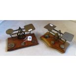 Two sets of brass postal scales