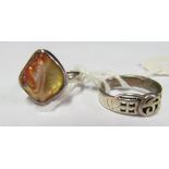 A silver ring set mother of pearl and another marked 925 PT