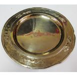A silver plate with dogs chasing fox to rim maker E V