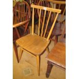 A pair of vintage Ercol stick back chairs