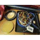 A silver bangle bracelet and a small group of costume jewellery