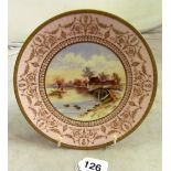 A Wedgwood plate hand painted and gilt bridge over river c1890s