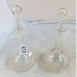 A pair of Edwardian decanters with long facetted necks etched vine leaf design