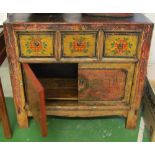 An oriental cabinet three drawers and two cupboards
