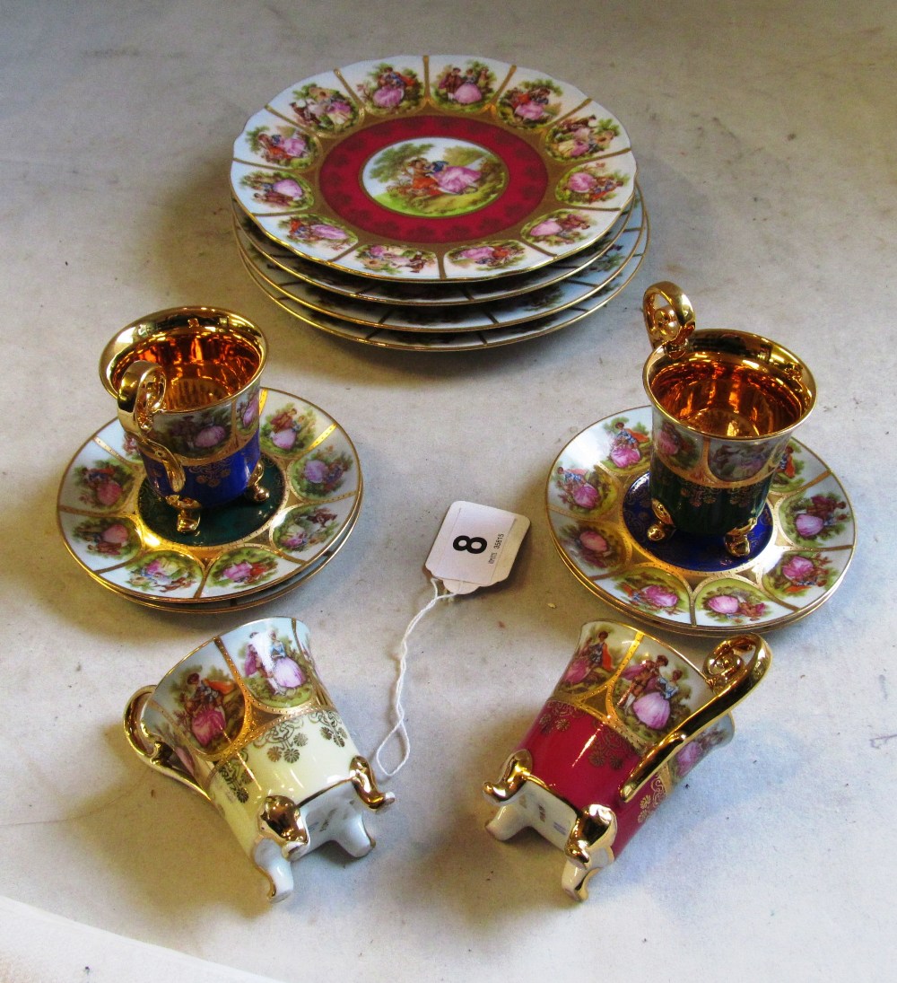 Four Vienna plates, four saucers and four cups