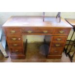 A small twin pedestal desk of nine drawers