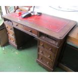 An Edwardian oak twin pedestal desk (two drawers missing)