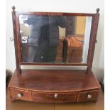 A 19th Century mahogany toilet mirror with satinwood edge and three drawers to base