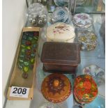 Two glass paperweights, some marbles and decorative boxes