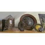 Three pieces of metalware, a circular framed head, an oval plaque and three medaillions etc