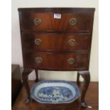 A mahogany bowfronted bedside cabinet and another