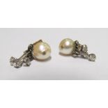 A pair of pearl and diamond drop earrings 9ct gold butterfly