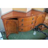 A walnut serpentine fronted sideboard