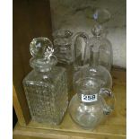 Four decanters and a jug