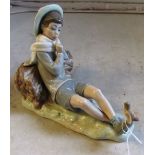 A Lladro figure boy with bird on his foot