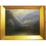 An oil on canvas lake scene with mountains in good gilt frame