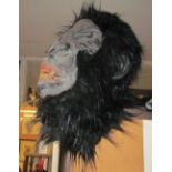 A gorilla mask and hands costume