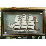 A 19th Century model of a three masted ship in black and gilt case