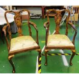 A pair of lacquer elbow chairs on cabriole legs