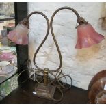 A two branch light with pink glass frilled shades