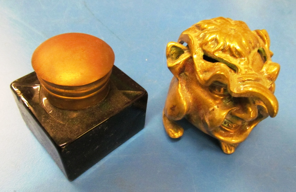 A brass inkwell and another inkwell
