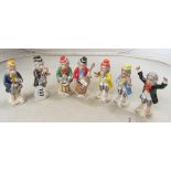 A set of seven Bavarian porcelain monkey band figures six playing instruments and a conductor