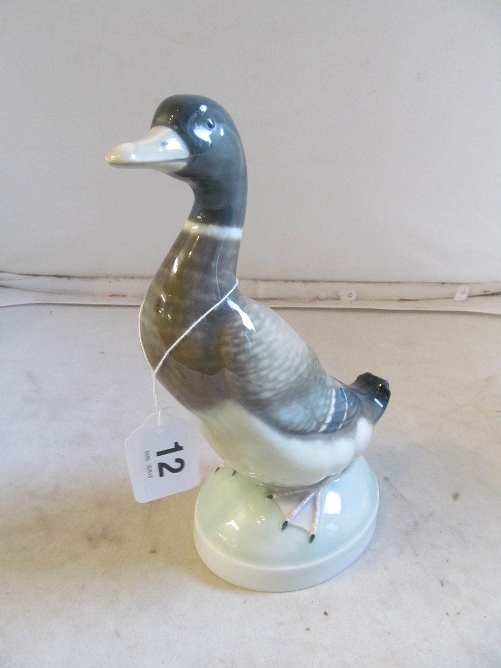 A Royal Copenhagen duck, a tern (a/f) and another duck ornament