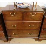 A 19th Century small mahogany chest of two short and two long drawers with brass swan neck handles