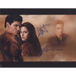 TWILIGHT- NEW MOON: Two colour signed 15 x 11 photographs by some of the leading actors of the