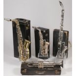 FOUR CASED WIND INSTRUMENTS