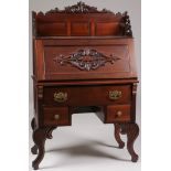 A CARVED WALNUT SECRETARY