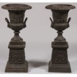 A PAIR OF BRONZE GARDEN URNS