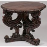 A CARVED OAK CENTER TABLE