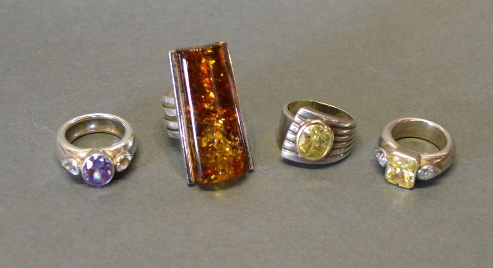 A Group of Four Silver Dress Rings