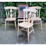 A Set of Four Pine Side Chairs, each with a pierced splat and spindle back with panel seat raised