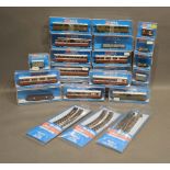 A Collection of Peco OO-9 Narrow Gauge Rolling Stock in boxes and three set rack packets