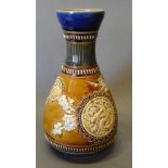 A Doulton Lambeth Vase decorated by Emily R Welch of oviform, decorated in relief in the Chinese