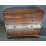An 19th Century Mahogany Straight Front Chest of two short and three long graduated drawers with