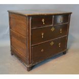 An 18th Century Oak Small Chest, the moulded top above two short and two long drawers with brass