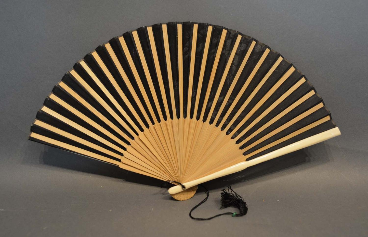 A Black Silk Leafed Fan, hand painted with dragonflies amongst foliage with bamboo sticks and - Image 2 of 2