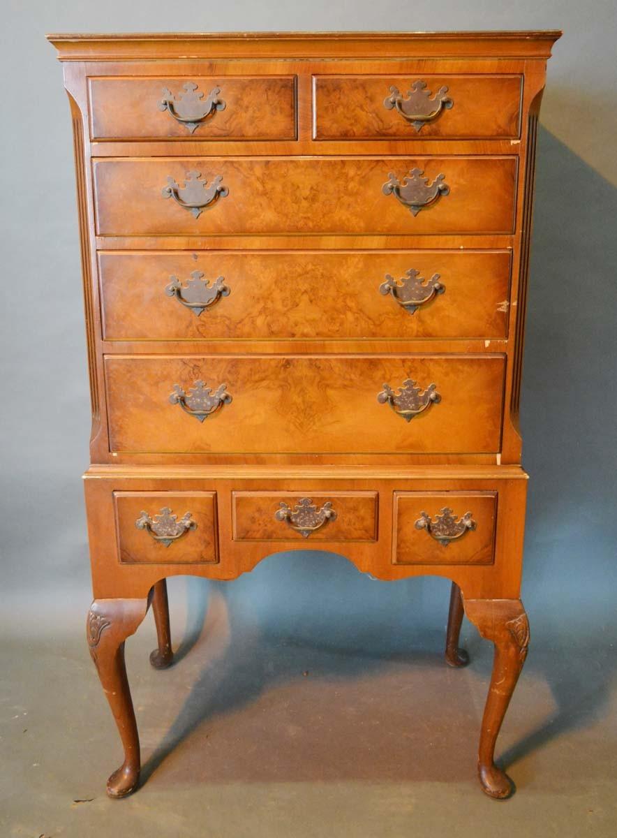 A 20th Century Queen Anne Style Walnut Chest on Stand, the moulded top above two short and three