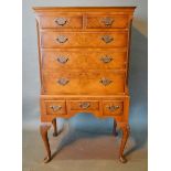 A 20th Century Queen Anne Style Walnut Chest on Stand, the moulded top above two short and three