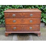A 19th Century Oak Chest, the moulded top above three drawers with oval brass handles raised upon