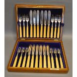 A Set of Twelve Sheffield Silver Fish Knives and Forks within fitted mahogany case