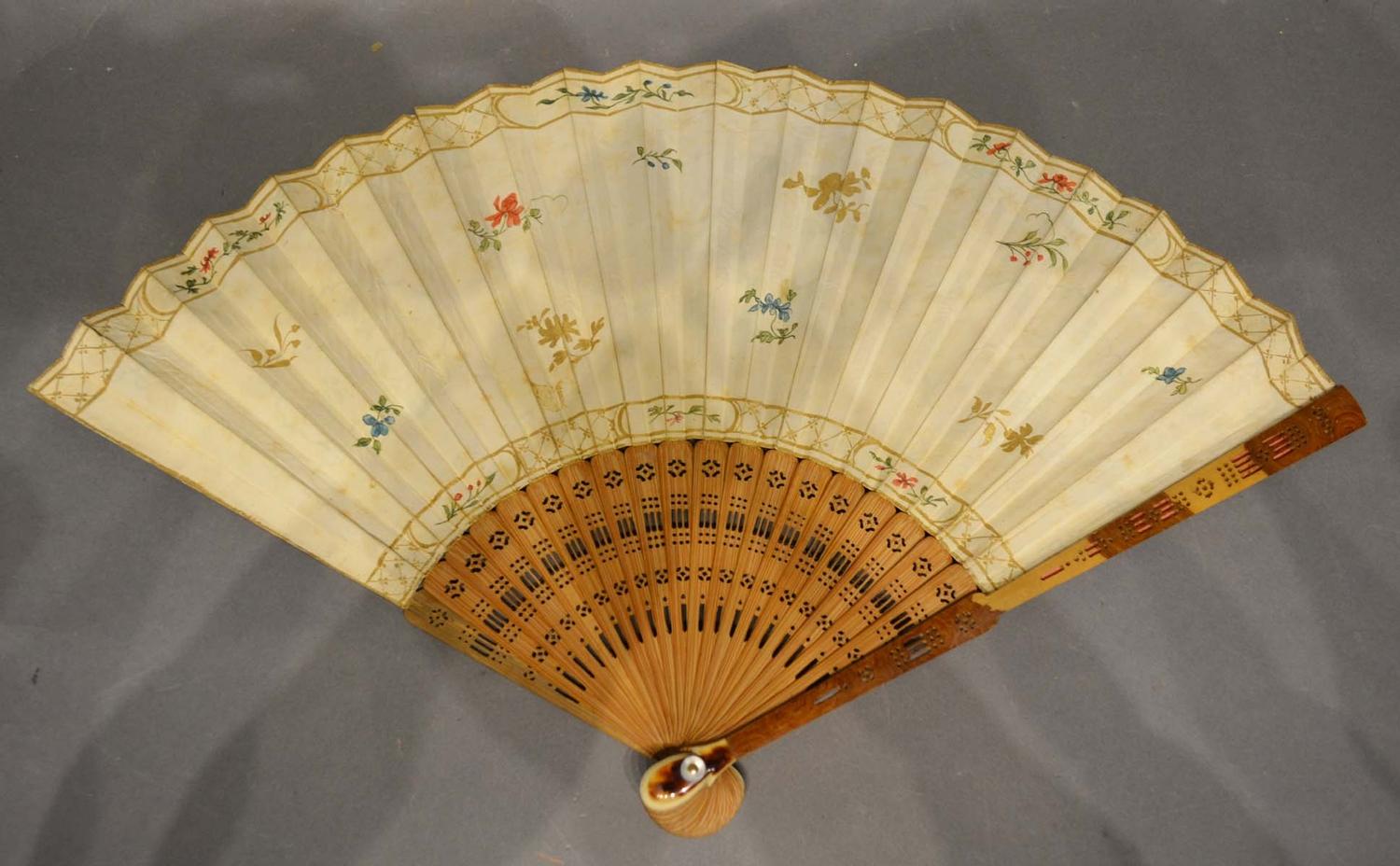 A 19th Century fan, hand painted with reserves within gilded decoration with finely pierced sticks - Image 2 of 2