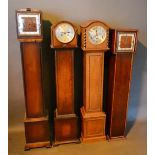 An Early 20th Century Oak Longcase Clock, together with three other similar oak longcase clocks