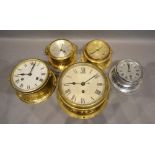 A Royal Mariner Brass Ship's Wall Clock, together with four other similar ship's clocks and three