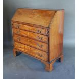 A 19th Century Mahogany Marquetry Inlaid Bureau, the fall front enclosing a fitted interior above