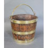 An Early 19th Century Oak Peat Bucket, brass bound and with brass handle, 29cm tall