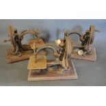 A Group of Three Early Sewing Machines by Willcox & Gibbs, New York, all with circular arms